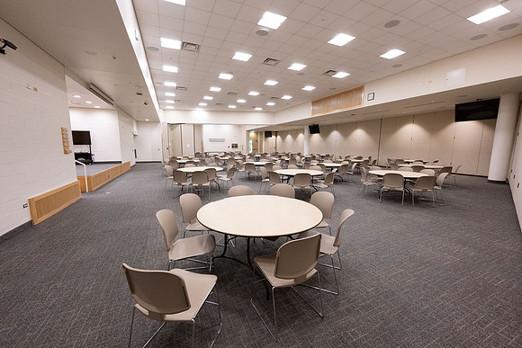 Taylor building room 160 and 170 set up with round tables for a Stake Relief Society Social.