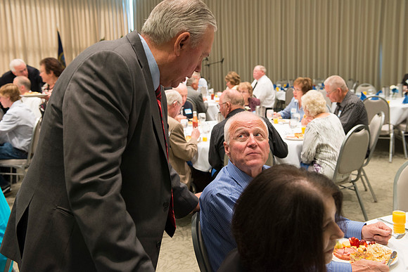 Alumni of the class of 1964 and earlier gather and honor the Briggs for their service.
