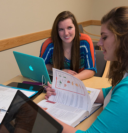 Students engage in an active study group for the new housing promo pictures.