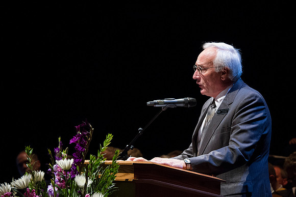 Alumni Representative Michael Rowley welcomes the new graduates to the BYU-Idaho Alumni during convocation in the Snow Building.