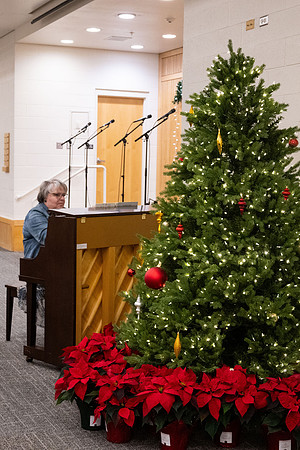 Employees gather for the annual Christmas gathering with President and Sister Meredith.