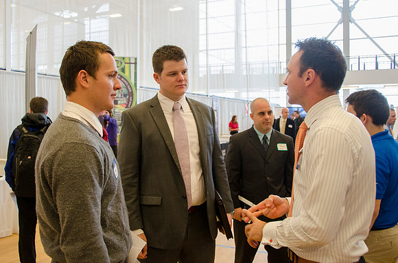 BYU-Idaho students speak to representatives from colleges or companies from their field of study at a career fair held in the I-Center gym