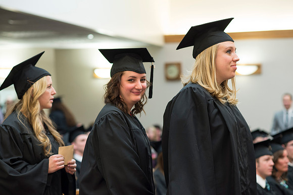 Students of the College of Human Development receive their diploma cover.