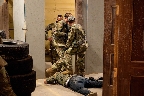 ROTC practices military tatics in an Advantage Airsoft facility.