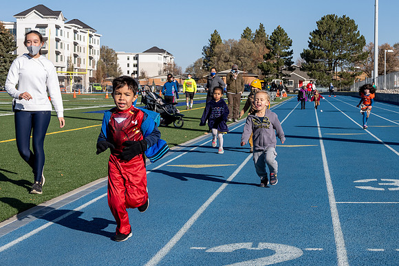 BYU-Idaho employees and their families enjoy a beautiful fall day at the stadium track.