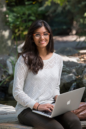Student Noor Sofi poses in the Gardens for online learning.