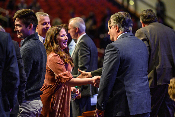 Participants chat after devotional, held in the BYU-Idaho Center.