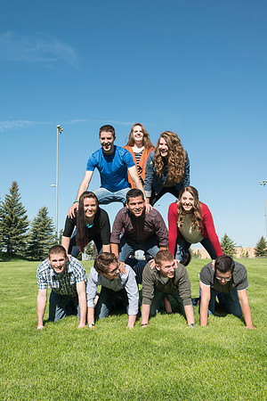 Student models interact and smile for marketing purposes that will be used for the new Campus Housing next to The Ivy.