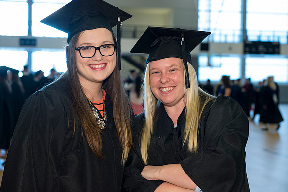 Graduates gather and march in during the processional for April 2014 Graduation ceremonies in the BYU-Idaho Center.