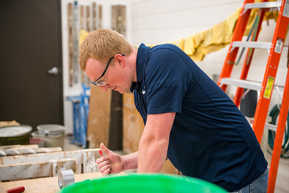 Civil engineering students work with different mixtures of cement to make a light, yet durable, cement that will be the building material for a canoe.