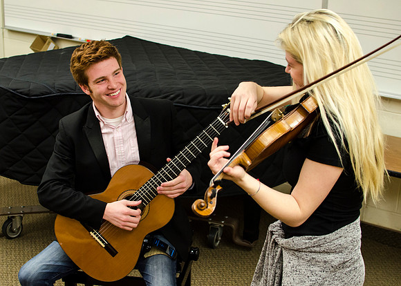 Students practice their music piece for their upcoming performance.