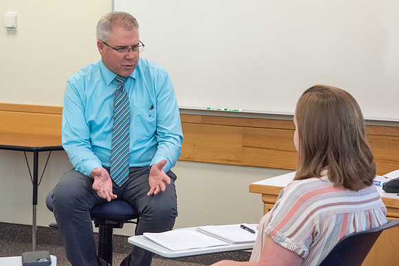 Instructor Brent Bean teaching Communication class.