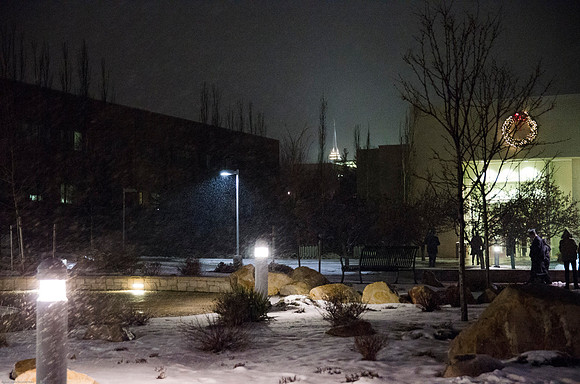Graduates and Famalies walk through light snow to respective Convocation Ceremonies.