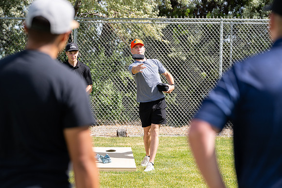 Students participate in the campus spikeball and cornhole tournament.