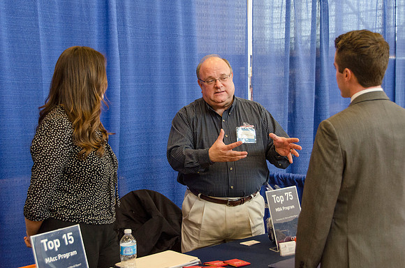 BYU-Idaho students speak to representatives from colleges or companies from their field of study at a career fair held in the I-Center gym