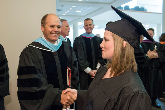 Graduates gather and march in during the processional for April 2014 Graduation ceremonies in the BYU-Idaho Center.