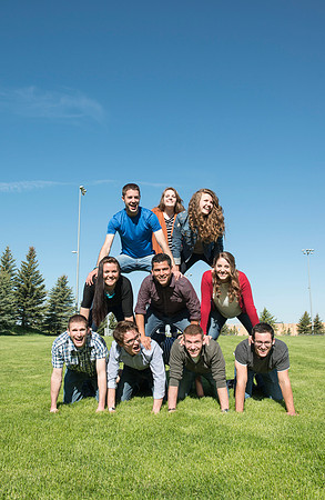 Student models interact and smile for marketing purposes that will be used for the new Campus Housing next to The Ivy.