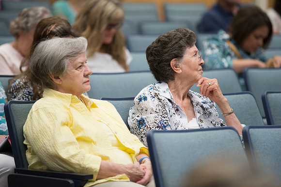 Adult participants listen to a class presented by Phil Packer.