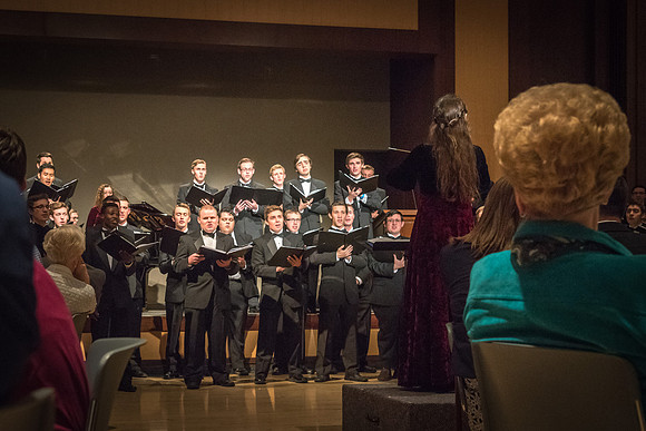 A choir performs a special musical number at the banquet.