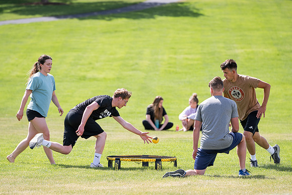 Students participate in the campus spikeball and cornhole tournament.