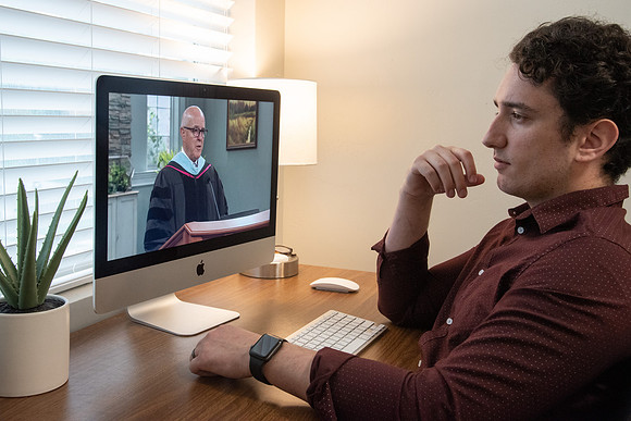 A BYU-Idaho Student watching Elder Clayton during the Spring Graduation Live Stream