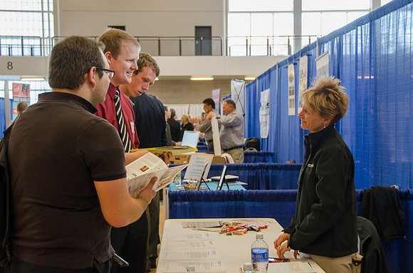 BYU-Idaho students speak to representatives from colleges or companies from their field of study at a career fair held in the I-Center gym