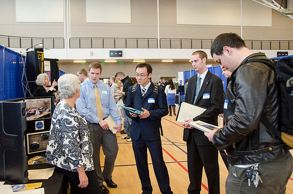 BYU-Idaho students speak to representatives from colleges or companies from their field of study at a career fair held in the I-Center gym