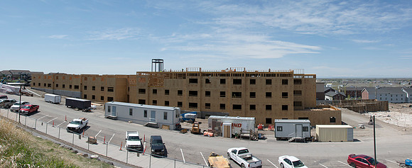 159 apartments will provide 873 beds. The complex includes piano rooms, individual and group study areas, and a central lounge.