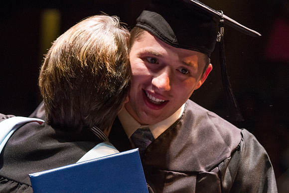 Dean's of the College of Performing and Visual Arts award diplomas to graduates during convocation held in the Snow Building.