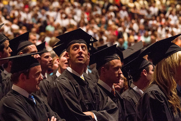 Graduating students from the 2014 Spring Semster gather in the I-Center for commencement. Photo by Tyler Rickenbach