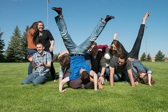Student models interact and smile for marketing purposes that will be used for the new Campus Housing next to The Ivy.