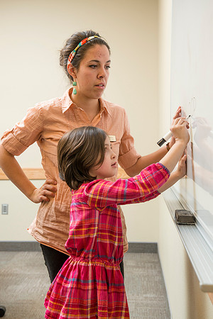 Teacher Education students offer their services tutoring kids 3rd grade to 12th grade. Kim Argueta tutoring Jenna Davis.