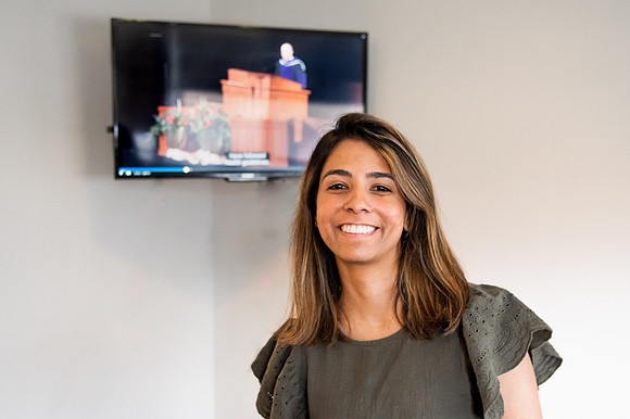 BYUI graduate Renata Flores watches Winter 2021 Commencement in her home with friends.
