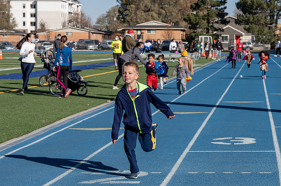 BYU-Idaho employees and their families enjoy a beautiful fall day at the stadium track.