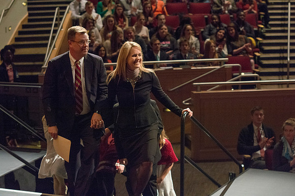 Brigham Young University-Idaho's newest President of the University, Clark Gilbert, walks up to the podium with his family. Photo by Ryan Chase