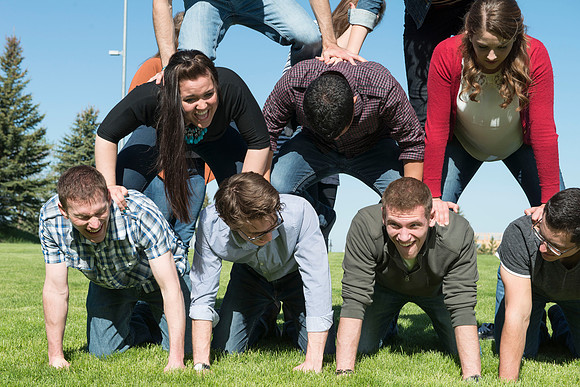 Student models interact and smile for marketing purposes that will be used for the new Campus Housing next to The Ivy.