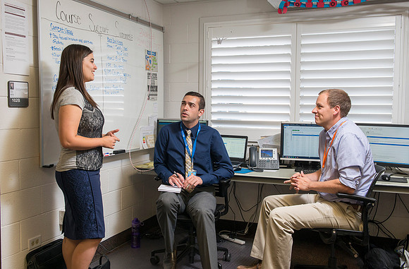 Student employees working together in Course Improvement.