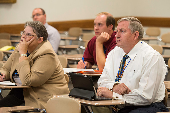 Faculty gather in the Hinckley Building for a conference to learn from their peers.