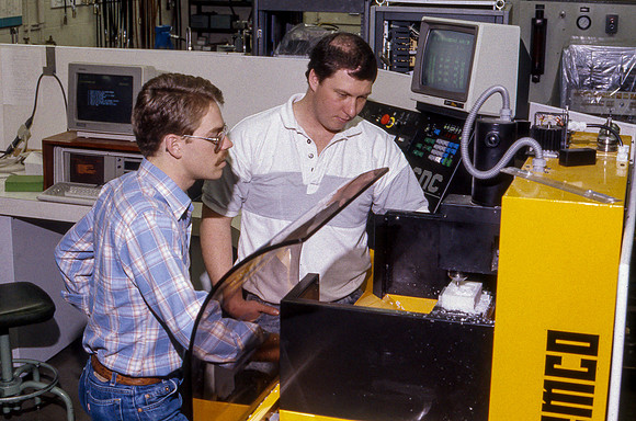 Student works alongside teacher in Manufacturing Technology. January 1990.
