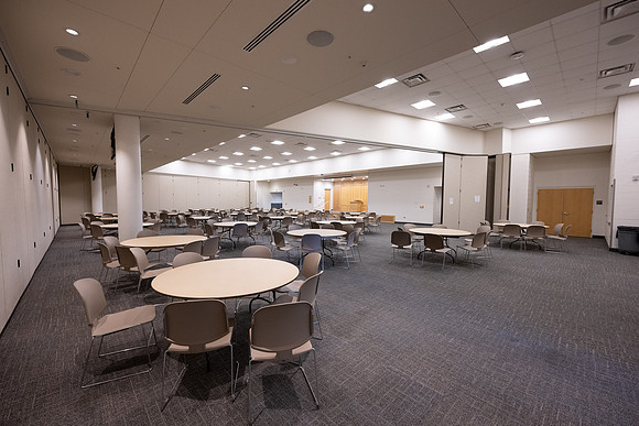 Taylor building room 160 and 170 set up with round tables for a Stake Relief Society Social.