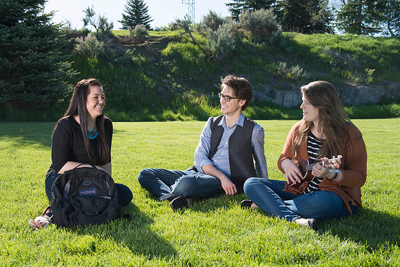 Student models interact and smile for marketing purposes that will be used for the new Campus Housing next to The Ivy.