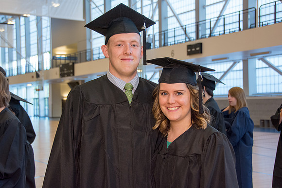 Students await commencement ceremony held in the BYU-Idaho Center.