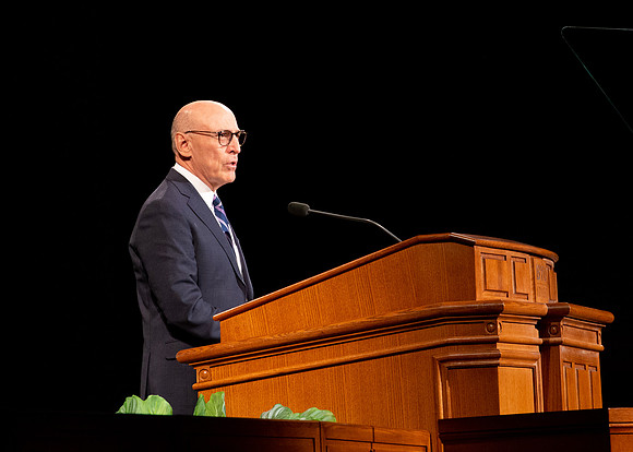 Elder Arnulfo Valenzuela giving a speech at the devotional.