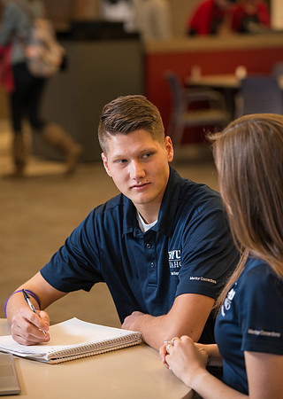 Student volunteers in Student Support work with new students in a Mentoring Program.