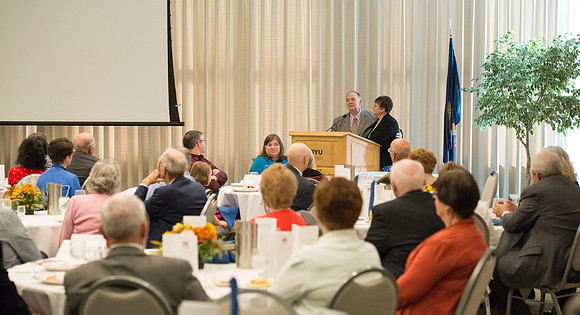 Ricks College Alumni gather to honor John and Trudy Bidwell at an Emeritus Breakfast.