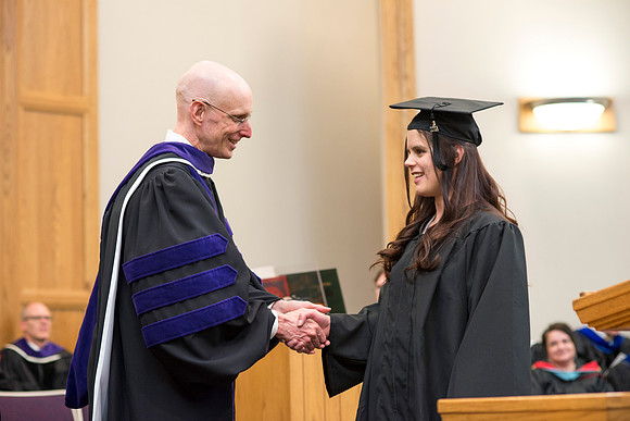 Students of the College of Human Development receive their diploma cover.