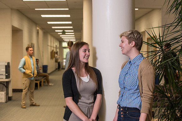 Information Technology students pose on campus for the department webpage.