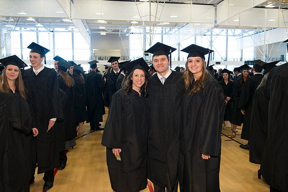 Graduates gather and march in during the processional for April 2014 Graduation ceremonies in the BYU-Idaho Center.