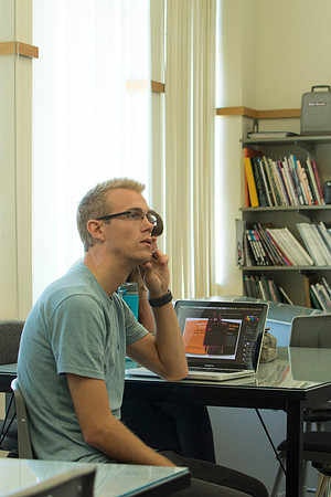 Design students go over their projects in Identity Design with instructor Scott Franson. These projects cover the use of logos and images in businesses.