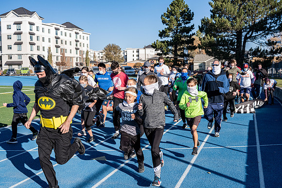 BYU-Idaho employees and their families enjoy a beautiful fall day at the stadium track.